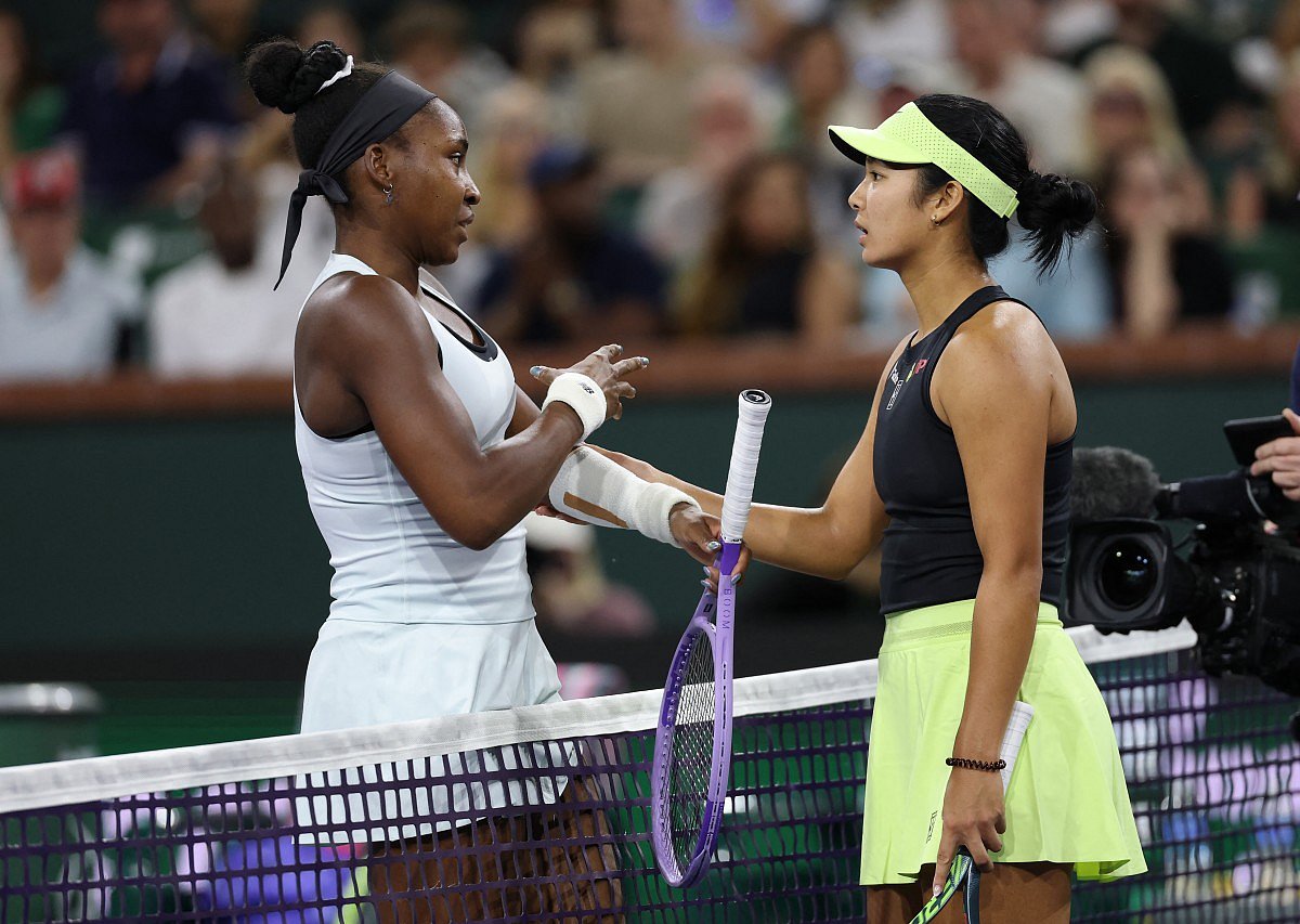 Coco Gauff of the United States at the net with Alexandra Eala of the Phiippines