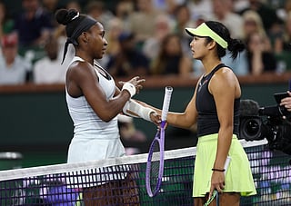 Coco Gauff of the United States at the net with Alexandra Eala of the Phiippines