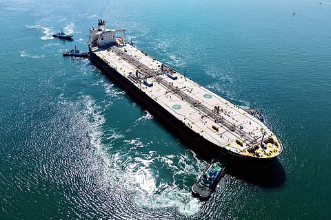 A crude oil tanker is guided to a berth at the oil terminal at the port in Qingdao, in China’s eastern Shandong province on March 7, 2026.