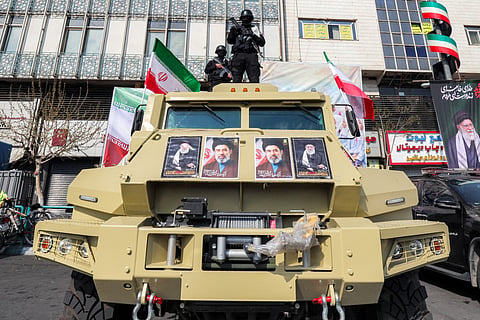 Security forces stand guard during a rally in support of Iran’s new Supreme Leader in central Tehran’s Enghelab Square on March 9, 2026.