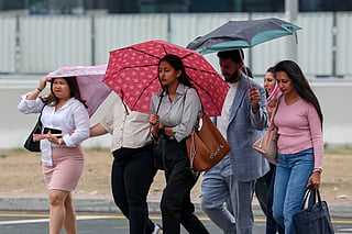 Residents caught in the rain in Dubai