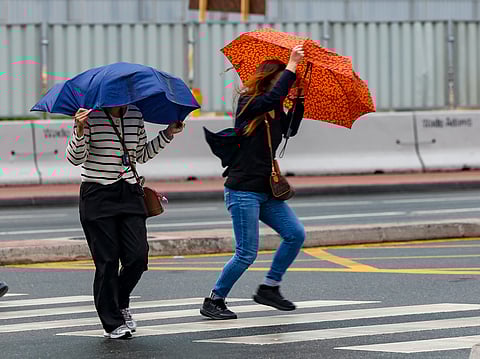 Residents caught in the rain in Dubai  