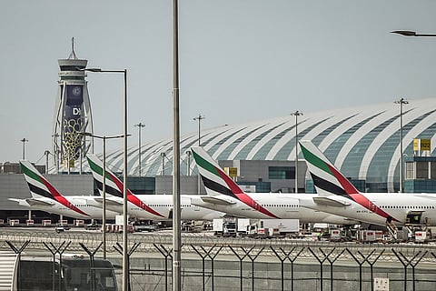 Passenger planes sit on the tarmac at Dubai International Airport in Dubai on March 11, 2026.