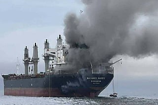 This handout photo taken on March 11, 2026 and released by the Royal Thai Navy shows smoke rising from the Thai bulk carrier 'Mayuree Naree' near the Strait of Hormuz after an attack.