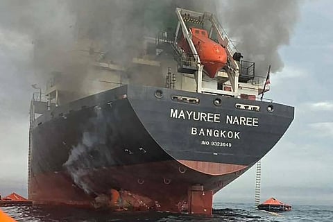 This handout photo taken on March 11, 2026 and released by the Royal Thai Navy shows smoke rising from the Thai bulk carrier 'Mayuree Naree' near the Strait of Hormuz after an attack.
