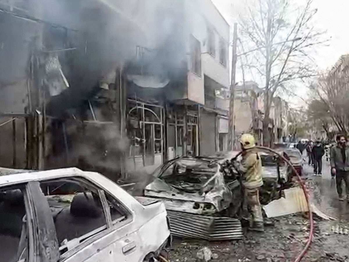 Firefighting operations are underway after the US-Israeli attacks in an area in Tehran on Wednesday, March 11, 2026. 