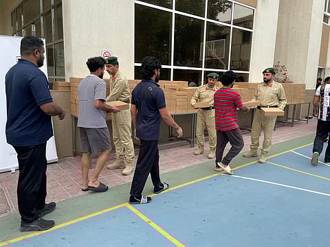 Dubai Police, UAE Food Bank distribute thousands of iftar meals to workers
