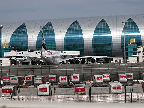 An Emirates Airlines plane is parked at Dubai International Airport in Dubai on March 11, 2026.
