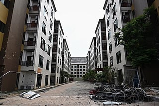 Damage sustained during fighting between Thailand and Cambodia is pictured on the outside of an abandoned scam centre in O'Smach town on the Thai-Cambodian border on March 12, 2026, during a press trip organised by Thailand's Ministry of Foreign Affairs and the Royal Thai Army.