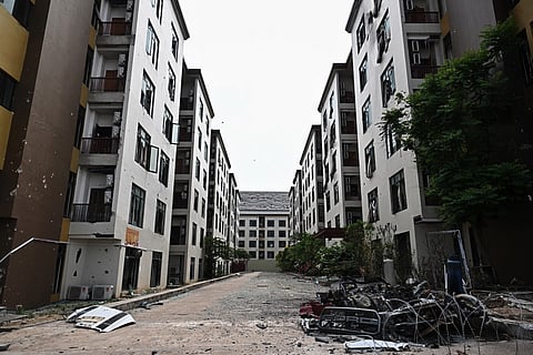 Damage sustained during fighting between Thailand and Cambodia is pictured on the outside of an abandoned scam centre in O'Smach town on the Thai-Cambodian border on March 12, 2026, during a press trip organised by Thailand's Ministry of Foreign Affairs and the Royal Thai Army.