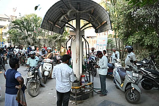 People queue up to refuel their vehicles at a gas station in Chennai as oil price spike caused by the war in the Middle East has sparked exasperation at petrol pumps around Asia, where many economies are heavily dependent on fossil fuel imports.