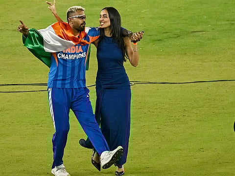 Indian cricketer Hardik Pandya along with his girlfriend and model Mahieka Sharma  celebrates after India's win in the 2026 ICC Men's T20 Cricket World Cup final match against New Zealand at the Narendra Modi Stadium in Ahmedabad on March 8, 2026. 