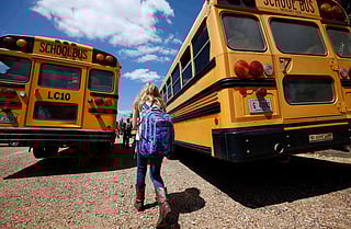 A student prepares to leave school, Aug. 13, 2014, southeast of Brookhaven, Mississippi. 