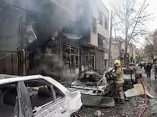 Firefighting operations are underway after the US-Israeli attacks in an area, in Tehran on Wednesday. 