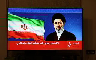This photo taken in Tehran shows a statement by Iran's new supreme leader Mojtaba Khamenei being televised on March 12, 2026.
