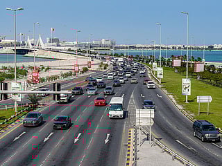 Vehicles move on a highway by the Muharraq Bridge in Bahrain's capital Manama.