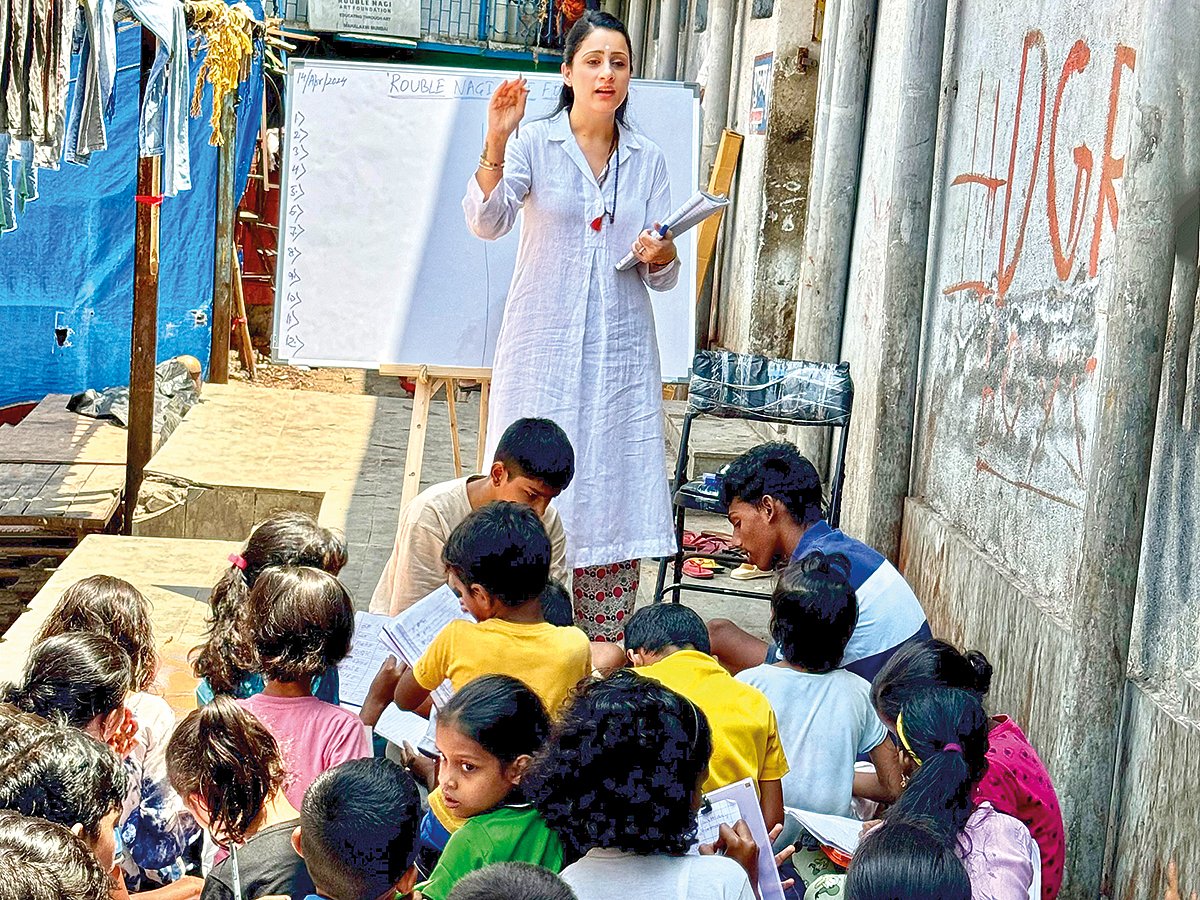 Rouble Nagi conducts a class for less privileged children in Mumbai.