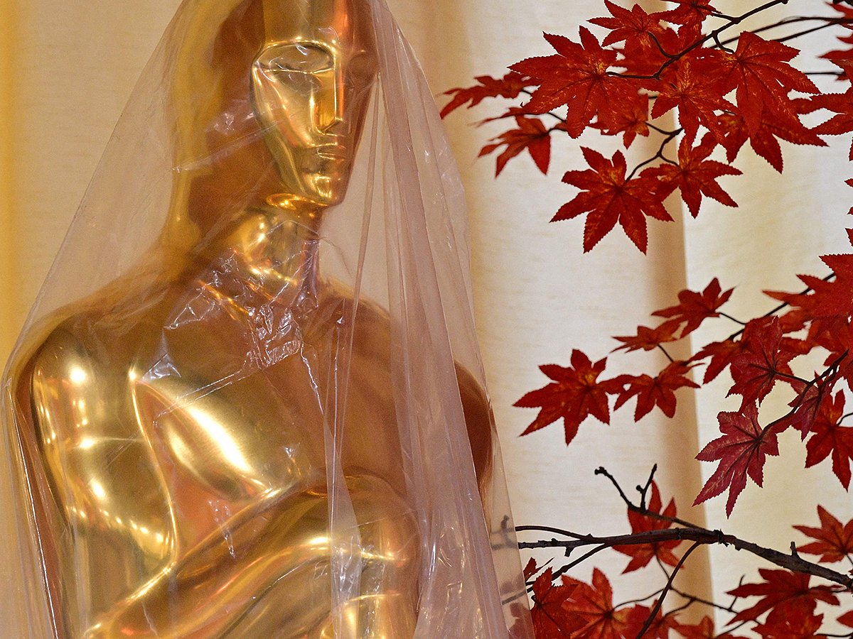 A decorative replica Oscar statue covered in protective plastic sheeting is seen as preparations are made on the red carpet arrivals area ahead of the 98th Annual Academy Awards in Hollywood, California, on March 13, 2026. 