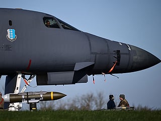 USAF military ground personnel prepare Joint Direct Attack Munitions (JDAM) for a US Air Force (USAF) B-1 Lancer bomber jet on the tarmac the tarmac at RAF Fairford in south-west England on March 14, 2026. Fairford is one of two bases, along with the Diego Garcia facility in the Indian Ocean, that the UK has given the US permission to use for ‘specific defensive operations into Iran’ to destroy Iranian missiles at source, the British defence minister said in a statement. AFP