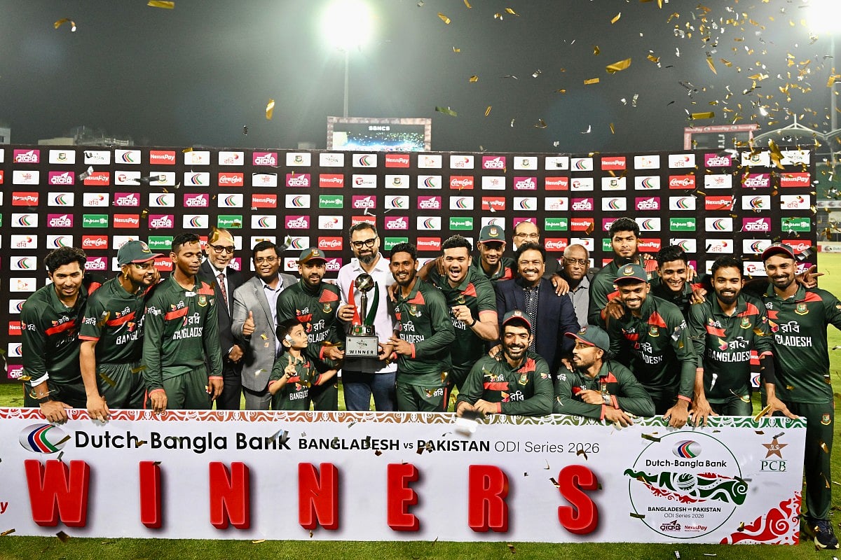 Bangladesh’s cricketers and support staff pose with the tournament trophy after the third one-day international (ODI) cricket match between Bangladesh and Pakistan at Sher-e-Bangla National Stadium in Mirpur on March 15, 2026.