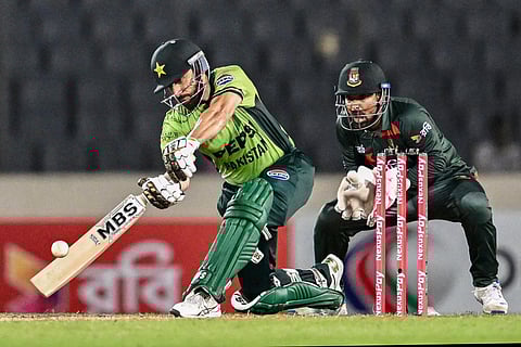 Pakistan’s Salman Agha (L) plays a shot during the third one-day international (ODI) cricket match between Bangladesh and Pakistan at Sher-e-Bangla National Stadium in Mirpur on March 15, 2026.