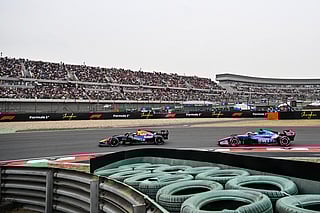 Red Bull Racing's Dutch driver Max Verstappen (L) and Alpine's French driver Pierre Gasly (R) drive during the Formula One Chinese Grand Prix at the Shanghai International Circuit in Shanghai on March 15, 2026.