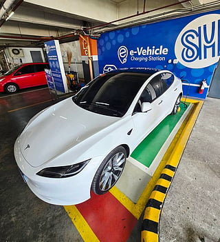 Filipino businessman Glenn Cuarto, a former OFW from the UAE, charges his Tesla Model 3 at a local mall. Location: SM City Cagayan de Oro. 