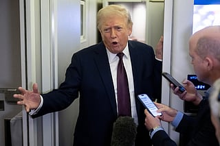 US President Donald Trump speaks with reporters aboard Air Force One during a flight from West Palm Beach, Florida, to Joint Base Andrews in Maryland, on March 15, 2026.
