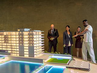 Francis Ngannou views the Armani Beach Residences model at the Arada sales centre in Dubai.