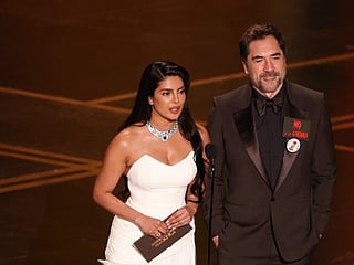 Indian actress Priyanka Chopra and Spanish actor Javier Bardem present the award for Best International Feature Film onstage during the 98th Annual Academy Awards at the Dolby Theatre in Hollywood, California on March 15, 2026.