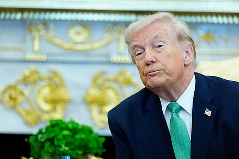 President Donald Trump listens to a reporter's question during a meeting with Irish Prime Minister Micheál Martin in the Oval Office of the White House, on St. Patrick's Day, Tuesday, March 17, 2026, in Washington. (AP Photo/Alex Brandon)