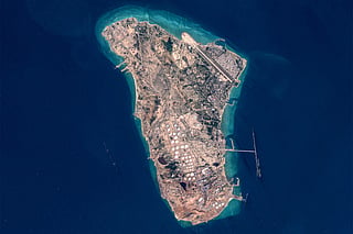 This handout image taken by the European Space Agency (ESA) captured by the Copernicus Sentinel-2 satellite shows a view of Iran's Kharg Island, which hosts the country’s main crude export terminal and is responsible for the overwhelming majority of its oil shipments to the world, about 30 kilometres south of the mainland in the north of the Gulf, on March 17, 2026.