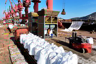 Fertilizer is unloaded from a ship at the port in Lianyungang, in China’s eastern Jiangsu province on March 19, 2026.