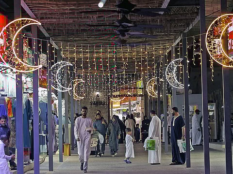 People shop for Eid Al Fitr in Sharjah.  
