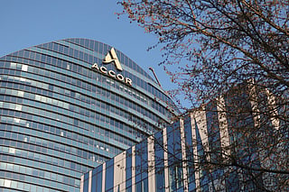 Logo of French multinational hospitality company Accor displayed on the facade of its headquarters in Issy-les-Moulineaux, outside Paris on March 19, 2026.