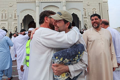 Celebrating Eid Al Fitr: Residents greet each other after prayers at Al Noor Mosque, Sharjah.