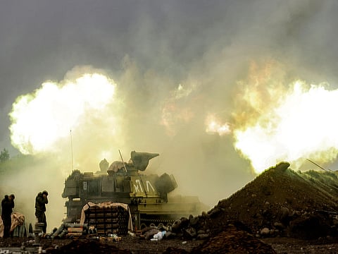 An Israeli self-propelled howitzer artillery gun fires rounds towards southern Lebanon from a position in the upper Galilee in northern Israel near the border on March 20, 2026.