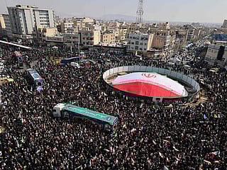 Iranian mourners gather during the funeral of Iran's security chief Ali Larijani and Gholamreza Soleimani, a senior officer in the Islamic Revolutionary Guard Corps who commands Basij forces, in Tehran on March 18, 2026.