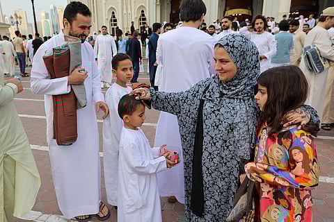 Kids distributing chocolates after Eid-Al-Fitr prayer at Al Noor mosque in Sharjah.  Photo: Virendra Saklani/Gulf News