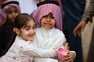 Children celebrate after the Eid al-Fitr prayers