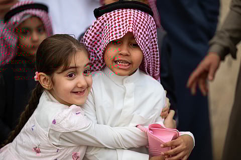 Children celebrate after the Eid al-Fitr prayers