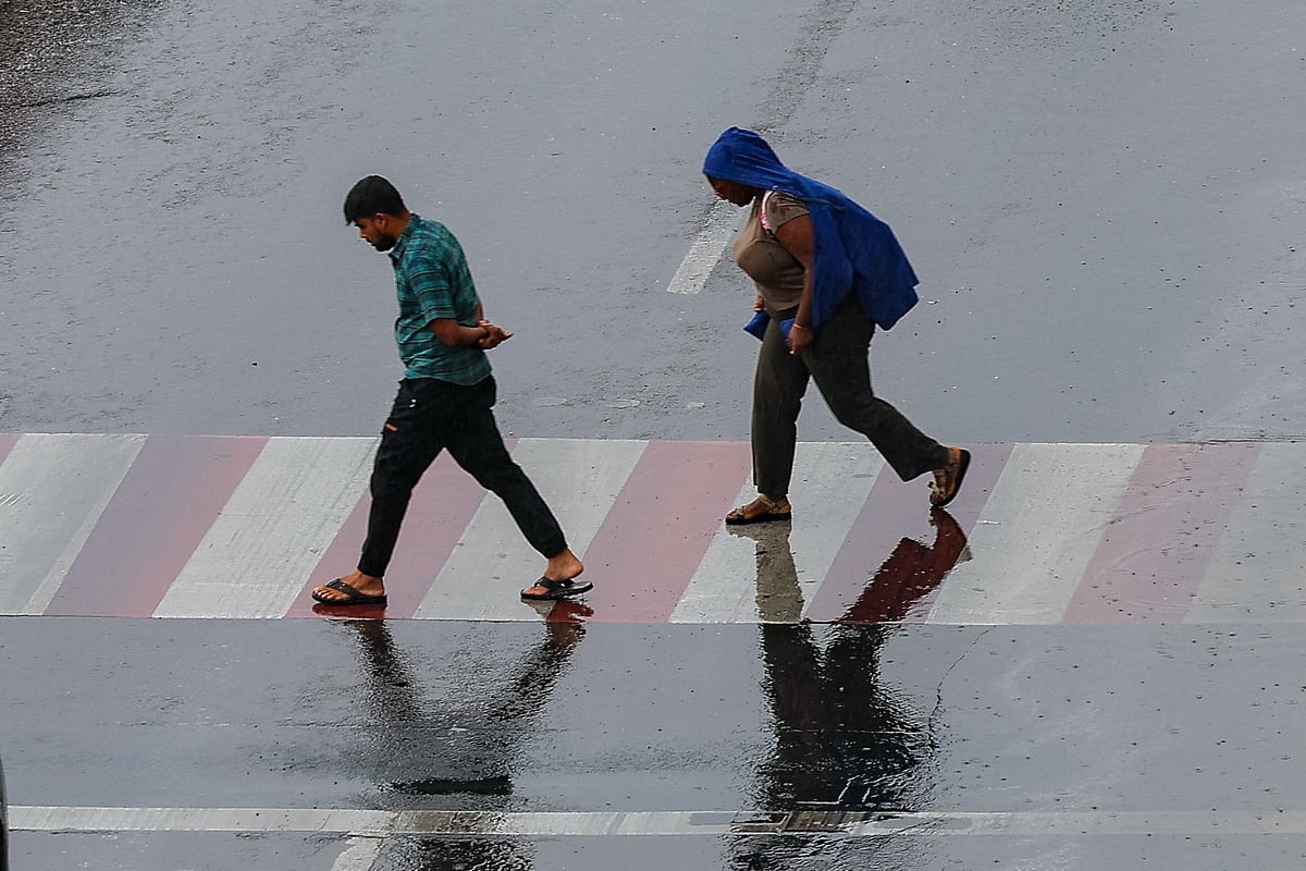 Residents brave the rain at Al Majaz, Sharjah. 