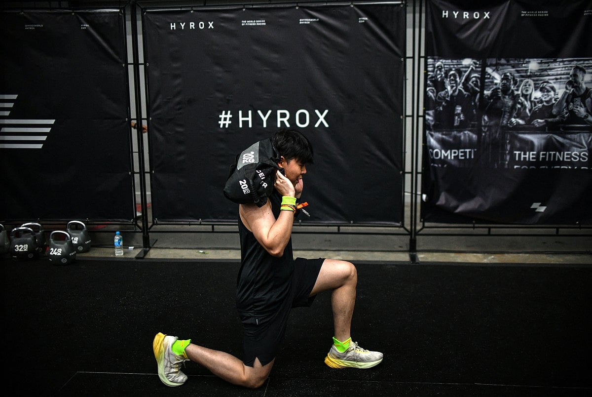 A participant warms up before competing in the Hyrox fitness race at the Bangkok International Trade and Exhibition Centre (BITEC) in Bangkok on March 21, 2026.
