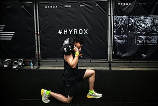 A participant warms up before competing in the Hyrox fitness race at the Bangkok International Trade and Exhibition Centre (BITEC) in Bangkok on March 21, 2026.
