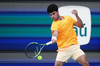 Carlos Alcaraz of Spain returns a shot against Sebastian Korda of the United States during Day 6 of the Miami Open at Hard Rock Stadium on March 22, 2026 in Miami Gardens, Florida.
