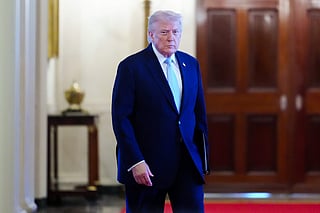 President Donald Trump arrives to the Commander-in-Chief's Trophy presentation with the Navy Midshipmen football team in the East Room of the White House.