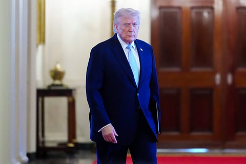President Donald Trump arrives to the Commander-in-Chief's Trophy presentation with the Navy Midshipmen football team in the East Room of the White House.