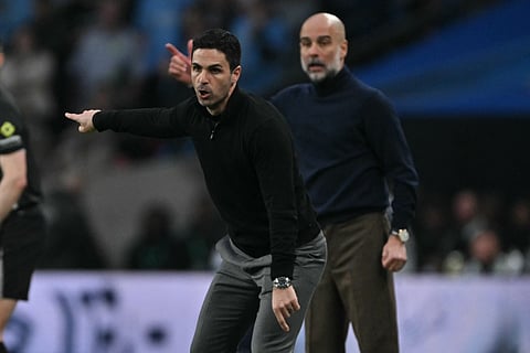Manchester City's Spanish manager Pep Guardiola (L) and Arsenal's Spanish manager Mikel Arteta (R) gesture on the touchline during the English League Cup final football match between ArsenaPredictionsl and Manchester City at Wembley Stadium in London on March 22, 2026.