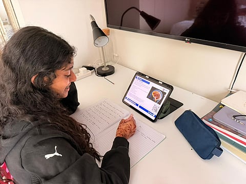 Ameya Shanavas, a student of GEMS Founders School in Dubai, participates in remote learning from her home in Dubai on Monday.
