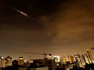 Rocket trails are seen in the sky amid a fresh barrage of Iranian missile attacks above the Israeli coastal city of Netanya on March 23, 2026.